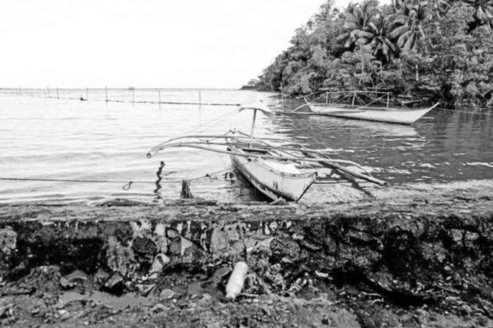 DESERTED. Fishing boats are left idle along the shoreline of Pola, Oriental Mindoro in this photo taken on Thursday, March 9, 2023, following the widespread oil spill that affects the livelihood of local fishermen. PHOTO COURTESY OF NOEL GUEVARA OF GREENPEACE