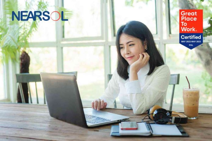 Young Asian businesswoman working online with laptop computer while sitting in coffee shop. Self-employed and freelance worker business activity concept.