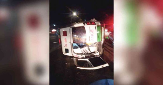 A patient-loaded ambulance turned on its side in Barotac Nuevo, Iloilo on Wednesday. It was hit by another vehicle. CHTRISTINA ALMERA