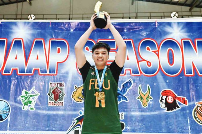 Bacolodnon setter Rhodson Du-ot hoist his Finals MVP trophy. UAAP PHOTO