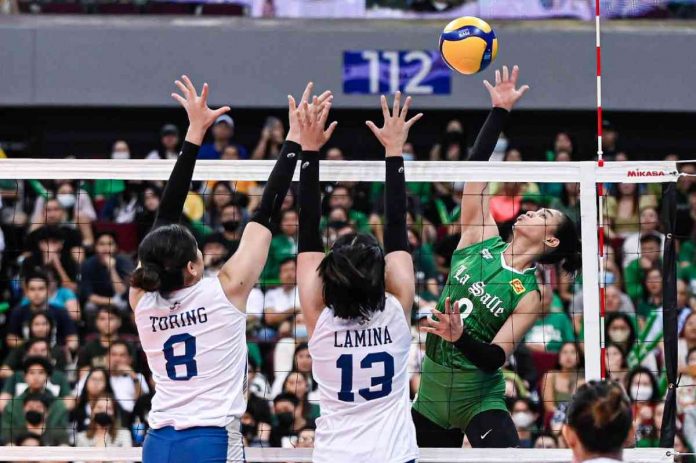 De La Salle University Lady Spikers’ Jolina dela Cruz scores against the defense of Guimarasnon Camille Lamina of National University Lady Bulldogs. UAAP PHOTO