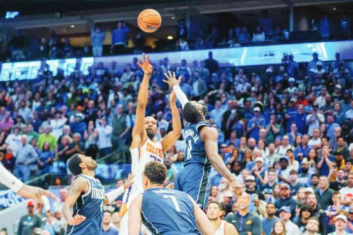 Phoenix Suns' Kevin Durant with his go-ahead jumper against the defense of Dallas Mavericks' Tim Hardaway Jr. and Kyrie Irving. PHOTO BY GARETH PATTERSON/AP