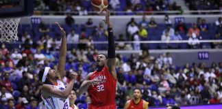 Barangay Ginebra San Miguel Kings’ Justin Brownlee soars for a basket against the defense of NLEX Road Warriors’ Brandon Ganuelas-Rosser. PBA PHOTO