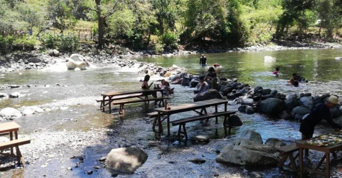 Residents and tourists enjoy swimming in a river in Tibiao, Antique which is still teeming with water despite the very hot weather condition being experienced in the province. ANNABEL CONSUELO J. PETINGLAY PHOTO