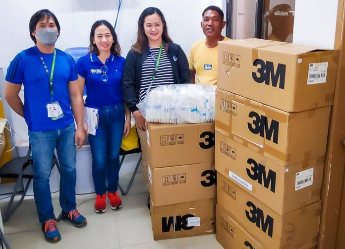 Palm Concepcion Power Corporation external affairs specialist, Engr. Cleope Lena (second from left), handed over the personal protective equipment to personnel of the Environmental Management Bureau Region VI on March 16.