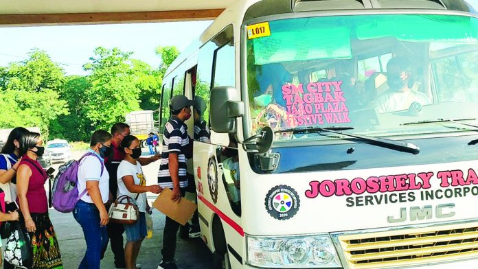 Passengers board a modernized jeepney at the Tagbak terminal in Jaro, Iloilo City. Tagbak to Festive Walk via SM City/Atria is one of the new routes under the enhanced Local Public Transport Route Plan of the city. AJ PALCULLO/PN