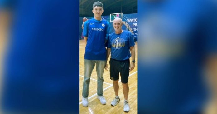 Negrense center Kobe Demisana is pictured with Ateneo de Manila University Blue Eagles head coach Thomas Baldwin during campus visit. SMART SPORTS PHOTO