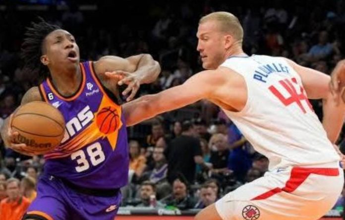 Phoenix Suns guard Saben Lee drives around LA Clippers center Mason Plumlee during the first half of an NBA basketball game, Sunday, April 9, 2023, in Phoenix, Arizona. AP PHOTO/RICK SCUTERI