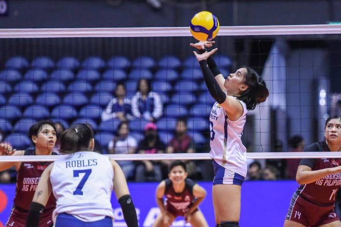 Guimarasnon Camille Lamina sets the ball to teammate Ilongga Princess Robles of the National University Lady Bulldogs. UAAP PHOTO