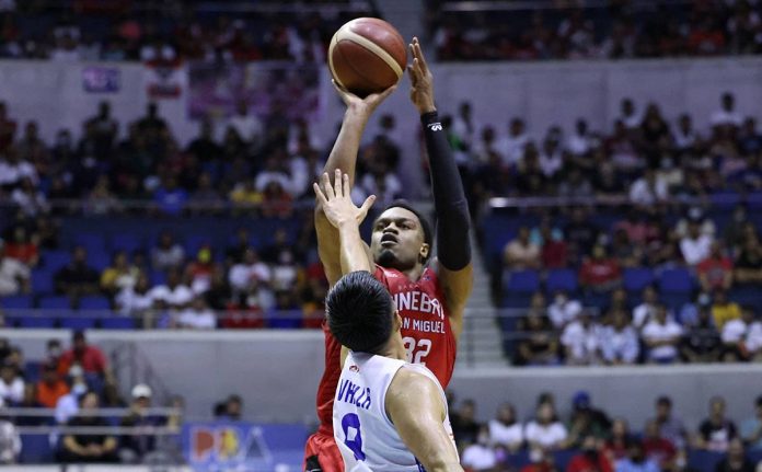 Barangay Ginebra San Miguel Kings’ Justin Brownlee pulls up for a shot against the defense of Negrense Paul Varilla of TNT Tropang Giga. PBA PHOTO