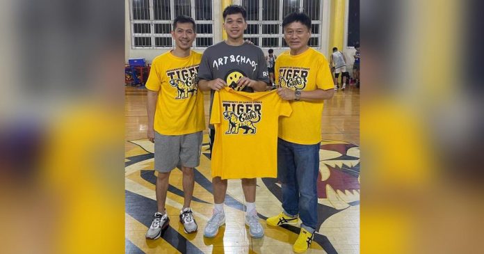 Dylan Despi is pictured with University of Santo Tomas Tiger Cubs head coach Manu Inigo and team manager Jarvis Co. CONTRIBUTED PHOTO