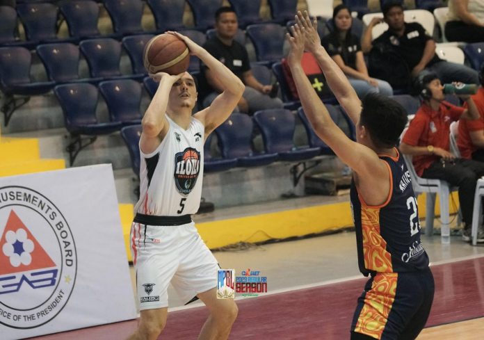 Iloilo United Royals-Cocolife’s Noah Korovesi attempts a three-pointer against the defense of Bicol Volcanoes’ Raymark Matias. MPBL PHOTO