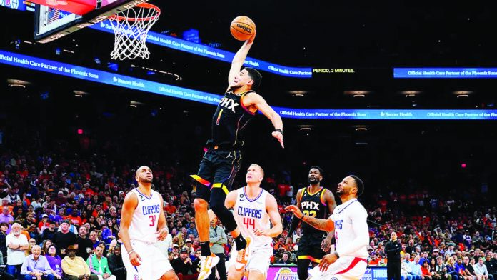 DEVIN Booker of the Phoenix Suns becomes just the third player in the past 25 seasons to score at least 25 points in a quarter during a playoff game. AP