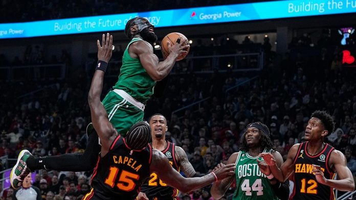 Jaylen Brown of the Boston Celtics goes for the basket against the Atlanta Hawks. Celtics advances to face the third-seeded Philadelphia 76ers. AP