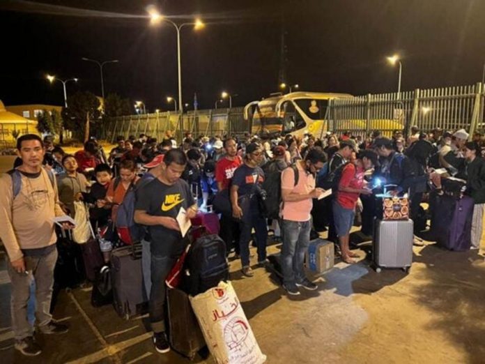 This photo from Department of Foreign Affairs shows Filipinos from Sudan making it safe to the Argeen border with Egypt. There is a civil war in Sudan.