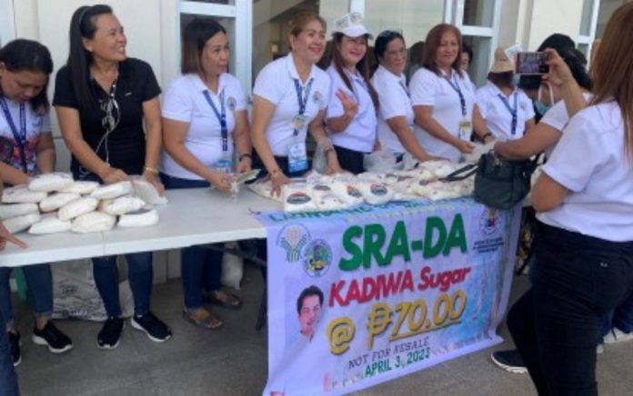 Personnel of the Bacolod City Cooperative and Livelihood Development Office sell Kadiwa sugar supplied by Victorias Milling Company at P70 per kilo during the launching of the program at the Government Center on Monday, April 3. BACOLOD CITY PIO PHOTO VIA PNA