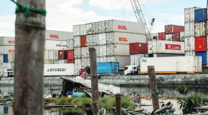 The Philippines’ annual total export sales from January to February 2023 reached $10.33 billion. Photo shows a man resting inside a floating house near a container port warehouse in Navotas, Manila. JONATHAN CELLONA, ABS-CBN NEWS/FILE PHOTO