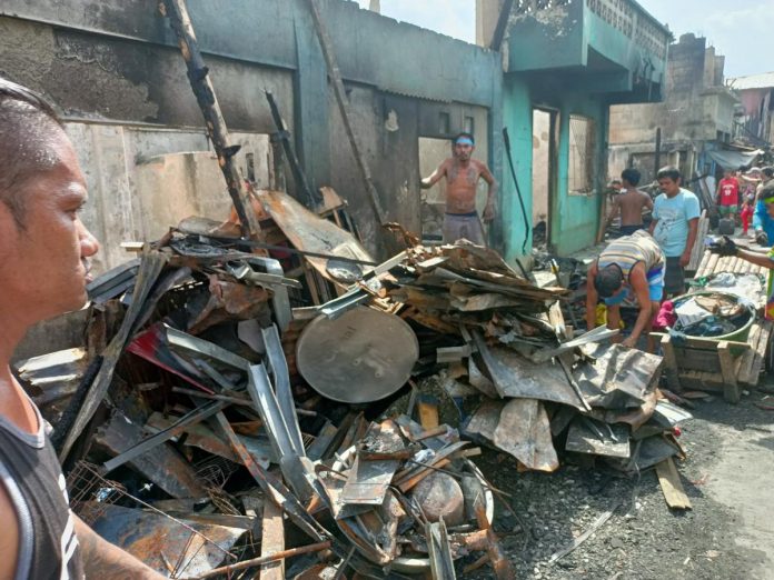 Residents of a neighborhood hit by fire in Barangay Rizal Pala-Pala II, Iloilo City salvage whatever’s left of their gutted houses. They are appealing for help. AJ PALCULLO/PN