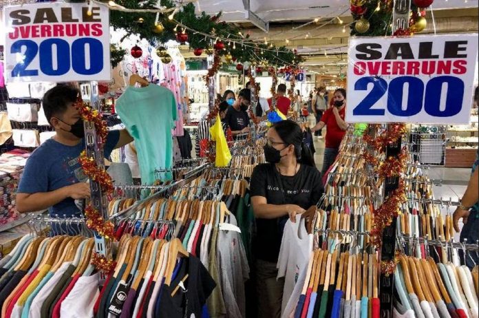 Shoppers sift through overrun clothes for sale inside the Greenhills Shopping Center in San Juan. GEORGE CALVELO, ABS-CBN NEWS/FILE PHOTO