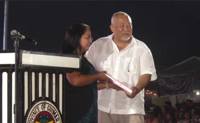 HISTORIC MOMENT. Dr. Hazel P. Villa, hands over a copy of her dissertation to Gov. JC Rahman Nava, in a groundbreaking moment in inspiring scholarly pursuits on the heritage of Guimaras. The turnover happened during the 31st provincehood celebration and Manggahan Festival, held on May 22, at the Capitol Event Area, Jordan, Guimaras. PRETTY PEARL KATE SERILO PHOTO