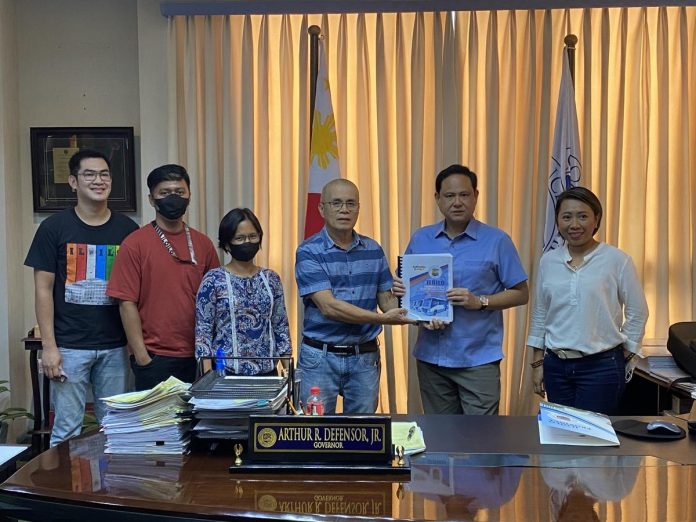 Iloilo Provincial Planning and Development Office chief Mario Nillos (4th from left) presents to Gov. Arthur Defensor Jr. a copy of the Iloilo Provincial Public Transport Route Plan 2023-2026 to be submitted to the Department of Transportation for approval. BALITA HALIN SA KAPITOLYO FB PHOTO