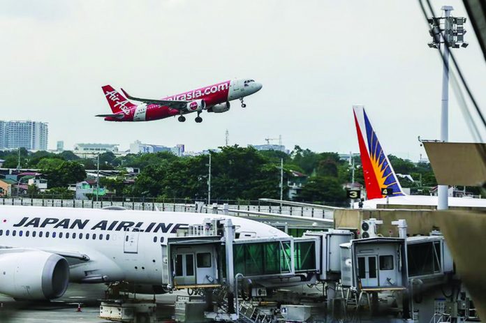 Flights take off at the Ninoy Aquino International Airport (NAIA) Terminal 1 after the momentary shutdown of the Philippine airspace due to maintenance work on Wednesday, May 17. JONATHAN CELLONA/ABS-CBN NEWS PHOTO