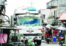 A garbage truck is collecting trash in Bacolod City in this undated photo. The city government will soon launch a mobile application that will allow households and business establishments to book a garbage pick-up. PNA BACOLOD FILE PHOTO