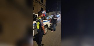 Last night's operation of the Iloilo City Public Safety and Transportation Management Office netted several traffic violators. Photo shows a traffic personnel apprehending a motorcycle driver with two kids as backriders, with no helmet and driver's license. PSTMO PHOTO