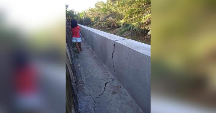 Ten families in Purok Tindalo, Barangay 1, San Carlos City, Negros Occidental were ordered to evacuate over the weekend after a portion of a retaining wall along the Palampas River showed signs of a potential collapse. SAN CARLOS CDRRMO PHOTO