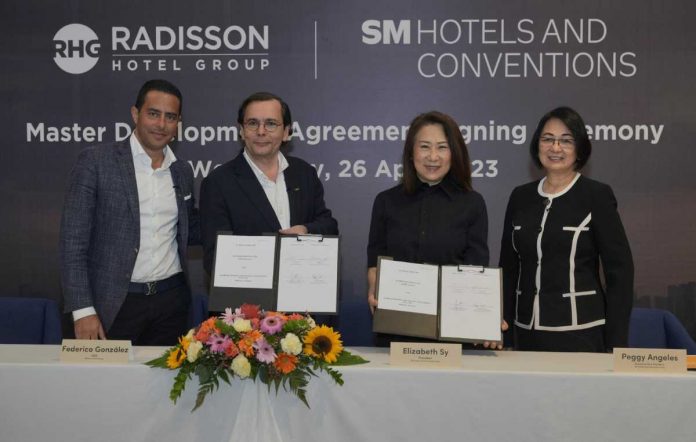 (L-R) Radisson Hotel Group (RHG) APAC Chief Development Officer Ramzy Fenianos, RHG Chief Executive Officer Federico González, SM Hotels and Conventions Corp. (SMHCC) President Elizabeth Sy, and SMHCC Executive Vice President Peggy Angeles, at the Master Development Agreement (MDA) signing ceremony.