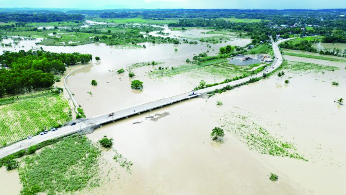 The Ulian Bridge in barangays Tinucoan and Capuling in Dueñas, Iloilo was submerged in floodwaters from Wednesday night, May 3, until Thursday morning, May 4. It became passable to vehicles by 12 noon on Thursday as seen in this photo. LGU DUEÑAS FACEBOOK PAGE PHOTO