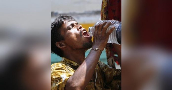 A man in Dhaka, Bangladesh drinks water amid a heatwave. GETTY IMAGES