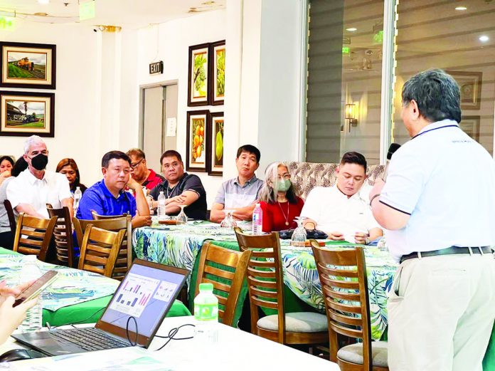 MORE Electric and Power Corporation (MORE Power) president and chief executive officer Roel Castro (right) presents to Negros Occidental officials the benefits that Negrenses could avail from the proposed joint venture agreement between Central Negros Electric Cooperative and Ignite Power, sister company of MORE Power.