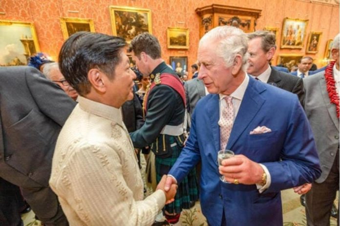 ‘DEEPLY HONORED’ President Ferdinand Marcos Jr. and King Charles III shake hands at a reception for heads of states in Buckingham Palace on Saturday morning before the coronation rites. PHOTO FROM BBM FB