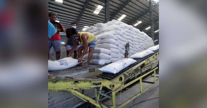 Workers unload sacks of rice at a National Food Authority warehouse in this undated photo. Data from the Department of Agriculture shows the total supply of rice in the country is estimated to be at 9.109 million metric tons for the first half of the year. PHOTO COURTESY OF PNA