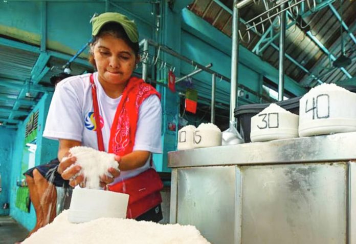 A salt vendor arranges mounds of salt at a public market in Marikina City on Tuesday, May 30. MARIA TAN/ABS-CBN NEWS PHOTO