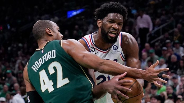 Yesterday was the third straight 30-point game in the series for Joel Embiid (right), who also had seven rebounds, four blocks and three 3-pointers. AP