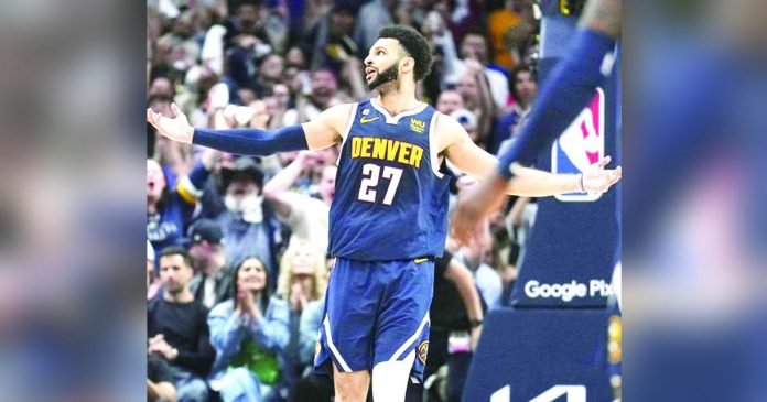 Denver Nuggets’ Jamal Murray catches fire in the fourth. AP