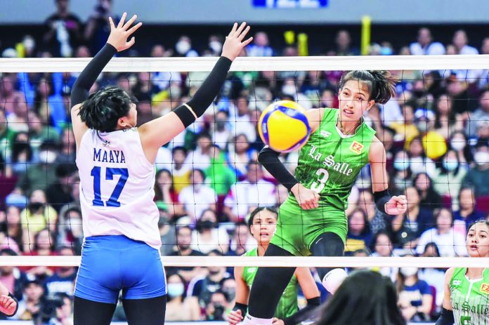 De La Salle University Lady Spikers’ Thea Gagate smashes the ball towards the defense of National University Lady Bulldogs’ Chams Maaya. UAAP PHOTO