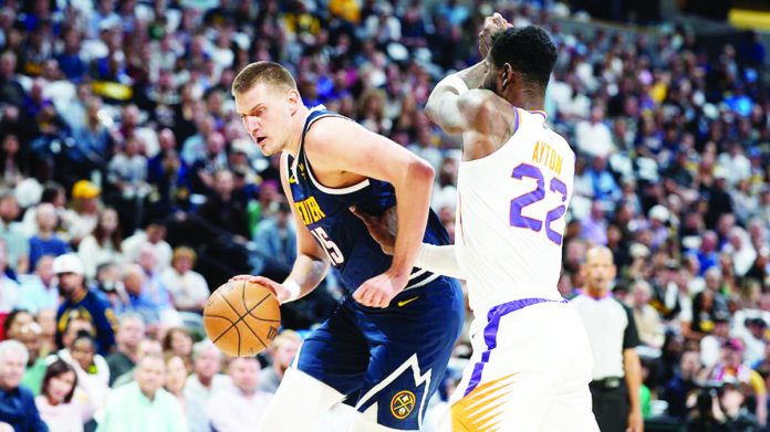 Denver Nuggets’ Nikola Jokic takes control of the ball as his team dumps the Phoenix Suns for a second straight win. AP