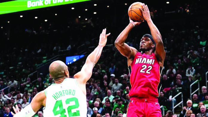 Miami Heat’s Jimmy Bulter takes control of the ball as the Heat defeats Boston Celtics in Game One of the Eastern Conference finals. AP