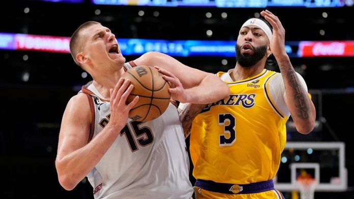 Denver Nuggets’ Nikola Jokic secures the ball from Los Angeles Lakers’ Anthony Davis. The Serbian big man led the Nuggets' tenacious defensive effort to reach the NBA Finals for the first time. AP