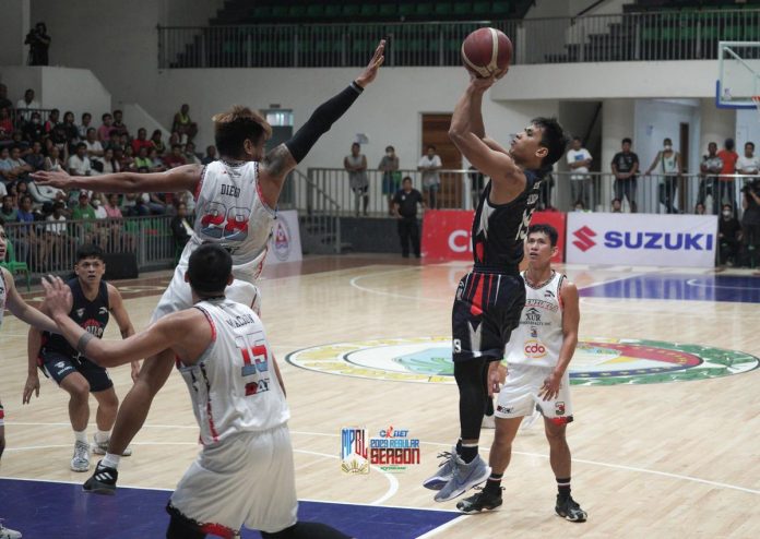 Iloilo United Royals-Cocolife’s Leo Guion III pulls up for a jumper against the defense of a Valenzuela XUR Homes Realty Inc. player. MPBL PHOTO