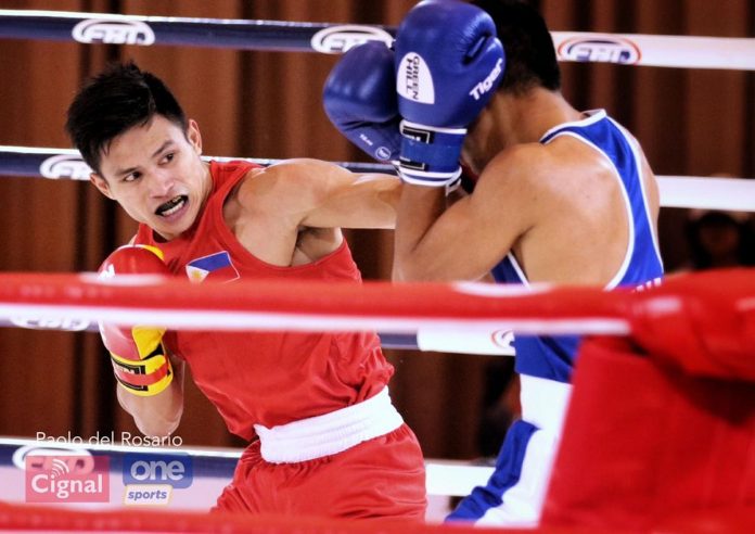 Negrense boxer Ian Clark Bautista lands a punch against Indonesian Asri Udin. PHOTO COURTESY OF PAOLO DEL ROSARIO/CIGNAL ONE SPORTS