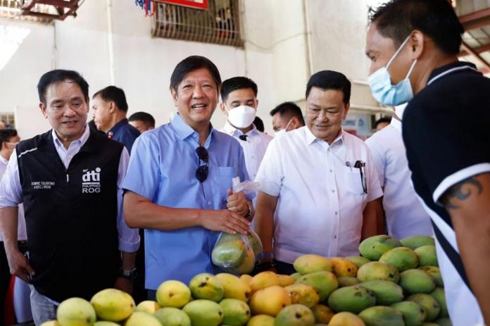 President Ferdinand Marcos Jr. checks products during the launching of Kadiwa ng Pangulo at San Jose del Monte, Bulacan. ALFRED FRIAS/PNA PHOTO