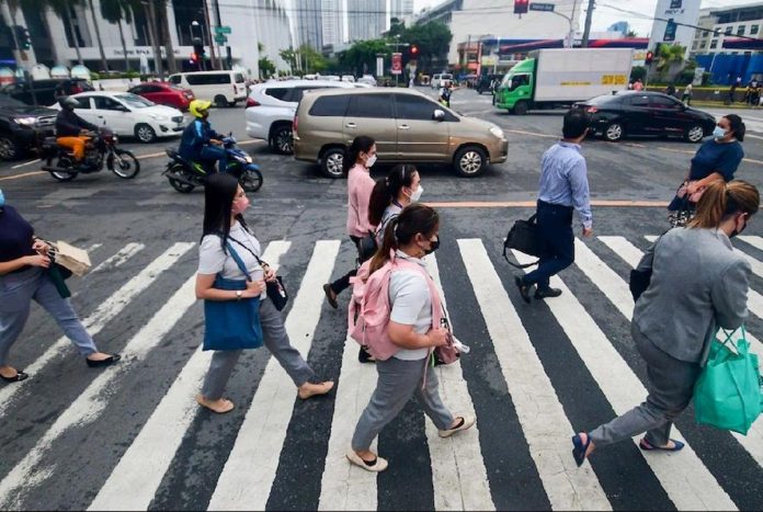 The quality of jobs in the Philippines has improved as seen in the reduction of underemployment in March this year. Photo shows office workers walking at a crossing in Makati City. MARK DEMAYO/ABS-CBN NEWS FILE PHOTO