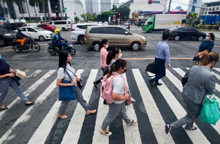 The quality of jobs in the Philippines has improved as seen in the reduction of underemployment in March this year. Photo shows office workers walking at a crossing in Makati City. MARK DEMAYO/ABS-CBN NEWS FILE PHOTO