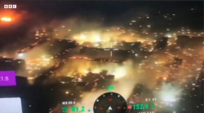 Bakhmut can be seen ablaze as what appears to be white phosphorus rains down on the city in this drone footage released by Ukraine's military. BBC