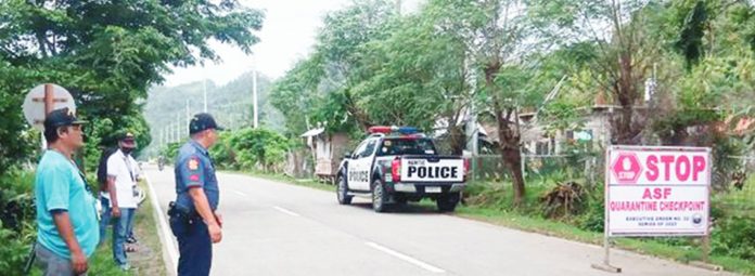 The municipality of Hamtic is the first to log confirmed cases of African Swine Fever (ASF) in Antique. Photos show an ASF control checkpoint in Barangay Banawon led by the local government unit, Provincial Veterinary Office and Hamtic police station. HAMTIC PNP PHOTO