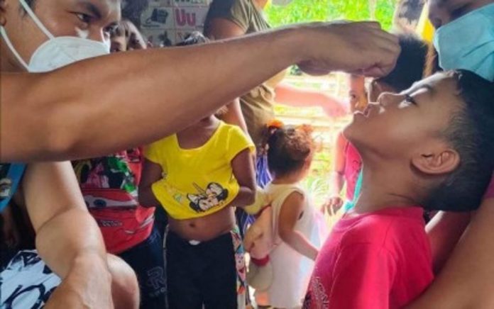 A child avails of the measles-rubella and oral polio vaccines during a supplemental immunization activity in Bugasong, Antique on May 8. Irene Duldoco, Antique Integrated Provincial Health Office information officer, said health workers are doing rapid coverage monitoring to locate children who have yet to avail of the immunization. ANTIQUE IPHO PHOTO